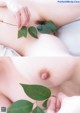 A woman laying on top of a bed holding a green leaf.